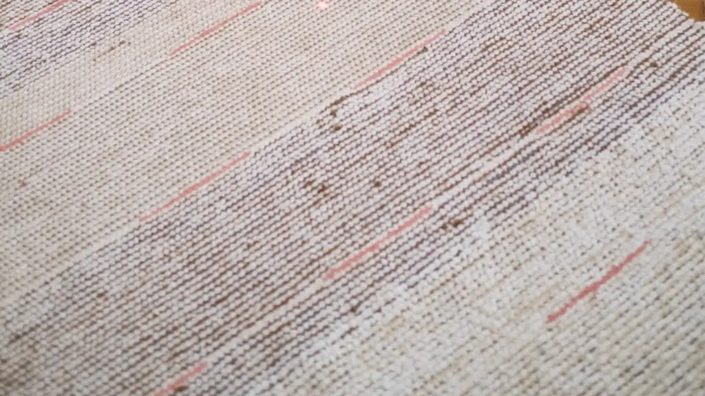 How to remove red candle wax stain from carpet?